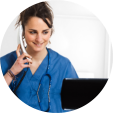 nurse in blue scrubs taking a call