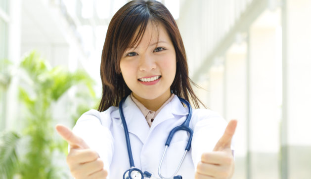 female nurse showing thumbs up
